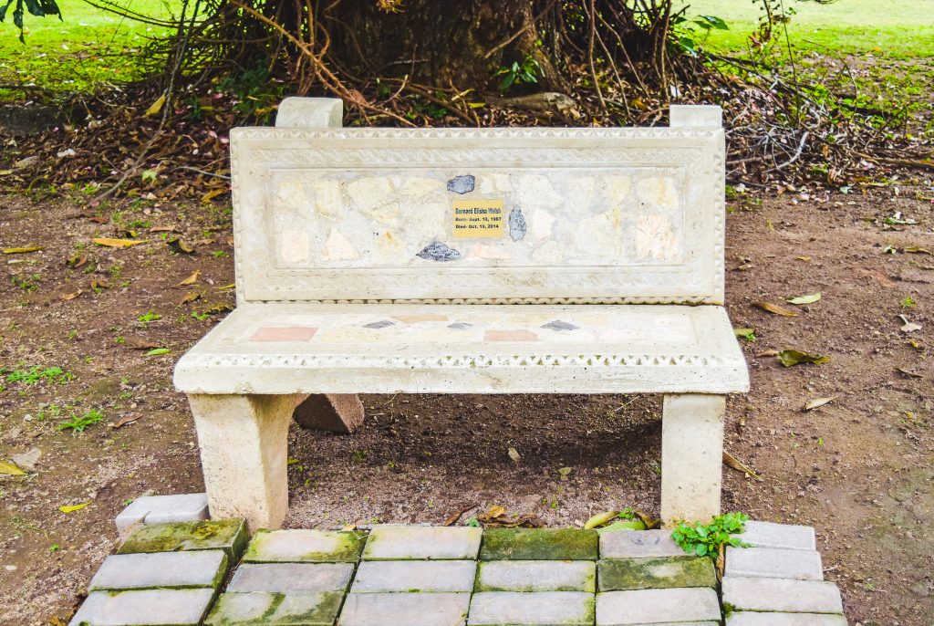 Mosaic bench on a shaded path